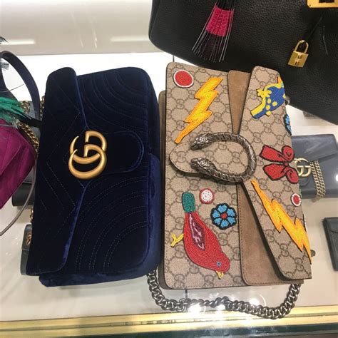 Gucci vs coach handbag